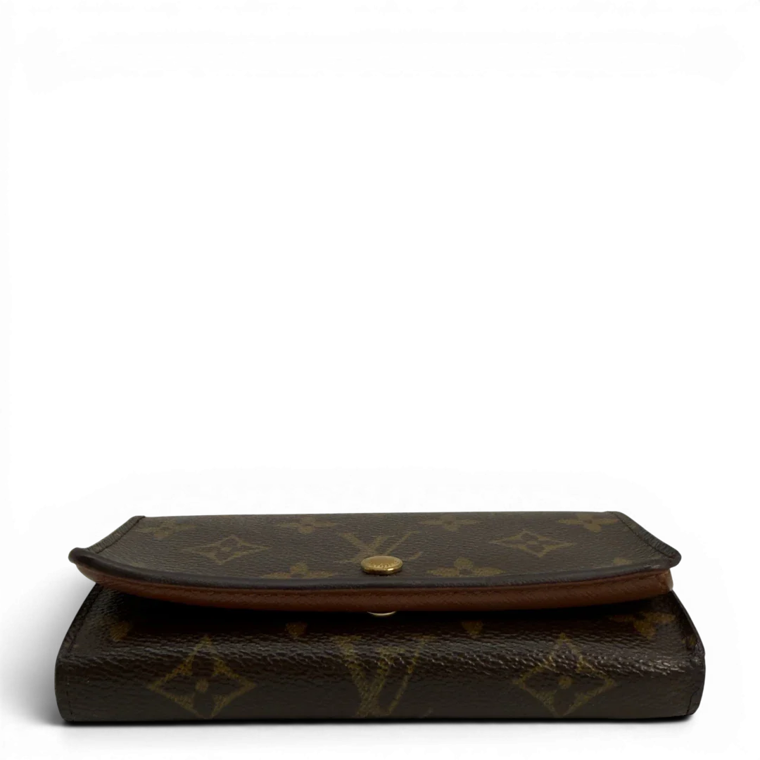 https://cdn.shopify.com/s/files/1/0564/9376/8855/files/Louis_Vuitton_Geldbeutel_Portefeuille_International_monogram_braun_vintage_LV8647.webp?v=1781084065