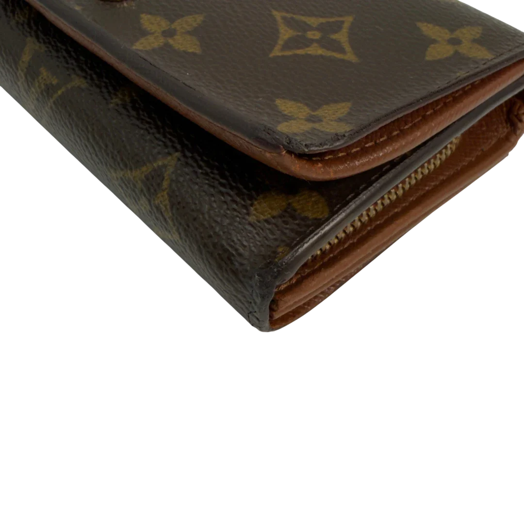 https://cdn.shopify.com/s/files/1/0564/9376/8855/files/Louis_Vuitton_Geldbeutel_Portefeuille_International_monogram_braun_vintage_LV8648.webp?v=1781084065