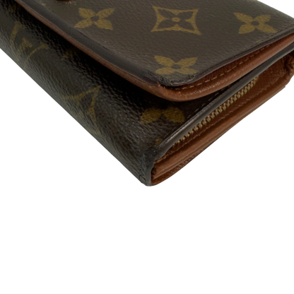 https://cdn.shopify.com/s/files/1/0564/9376/8855/files/Louis_Vuitton_Geldbeutel_Portefeuille_International_monogram_braun_vintage_LV8648.webp?v=1781084065