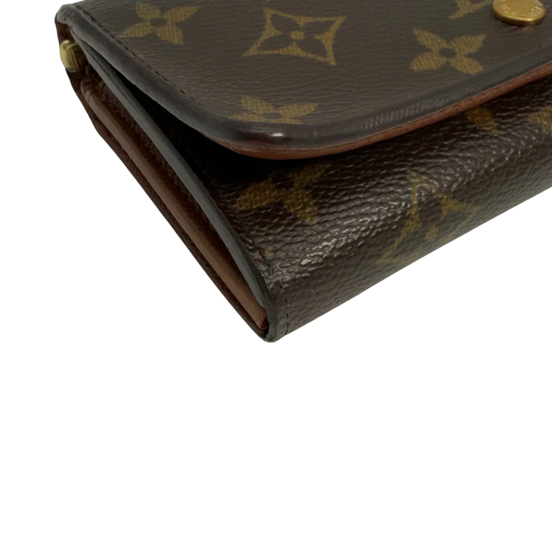 https://cdn.shopify.com/s/files/1/0564/9376/8855/files/Louis_Vuitton_Geldbeutel_Portefeuille_International_monogram_braun_vintage_LV8649.webp?v=1781084065