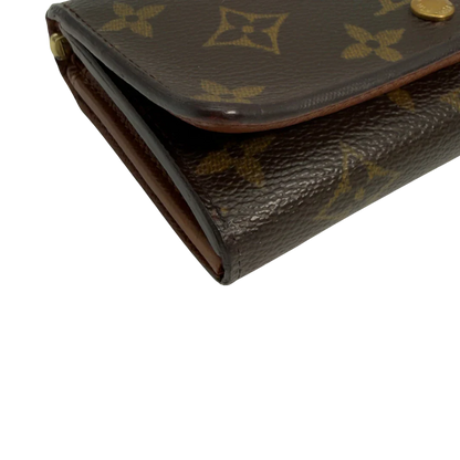 https://cdn.shopify.com/s/files/1/0564/9376/8855/files/Louis_Vuitton_Geldbeutel_Portefeuille_International_monogram_braun_vintage_LV8649.webp?v=1781084065