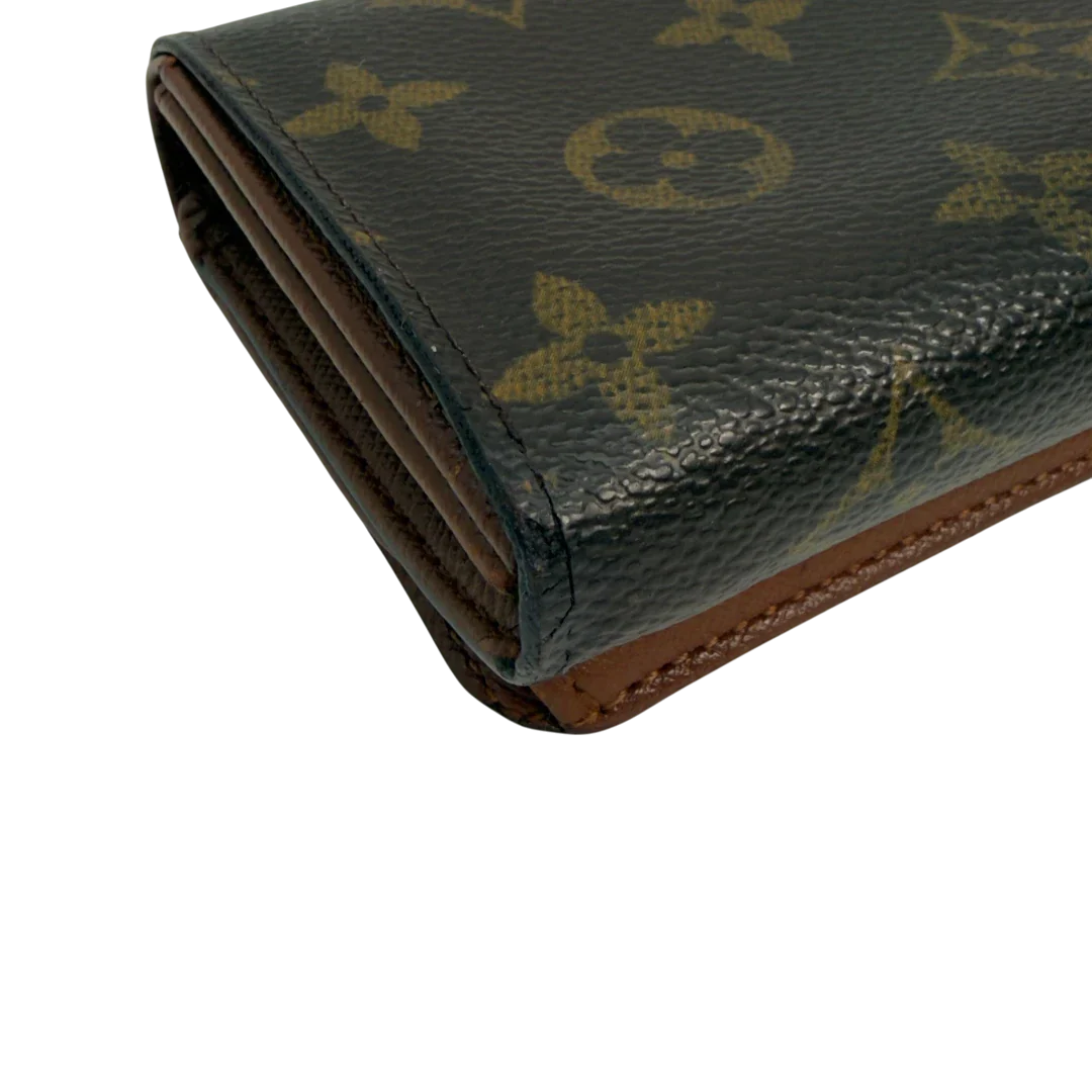 https://cdn.shopify.com/s/files/1/0564/9376/8855/files/Louis_Vuitton_Geldbeutel_Portefeuille_International_monogram_braun_vintage_LV8651.webp?v=1781084065