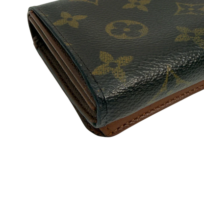 https://cdn.shopify.com/s/files/1/0564/9376/8855/files/Louis_Vuitton_Geldbeutel_Portefeuille_International_monogram_braun_vintage_LV8651.webp?v=1781084065