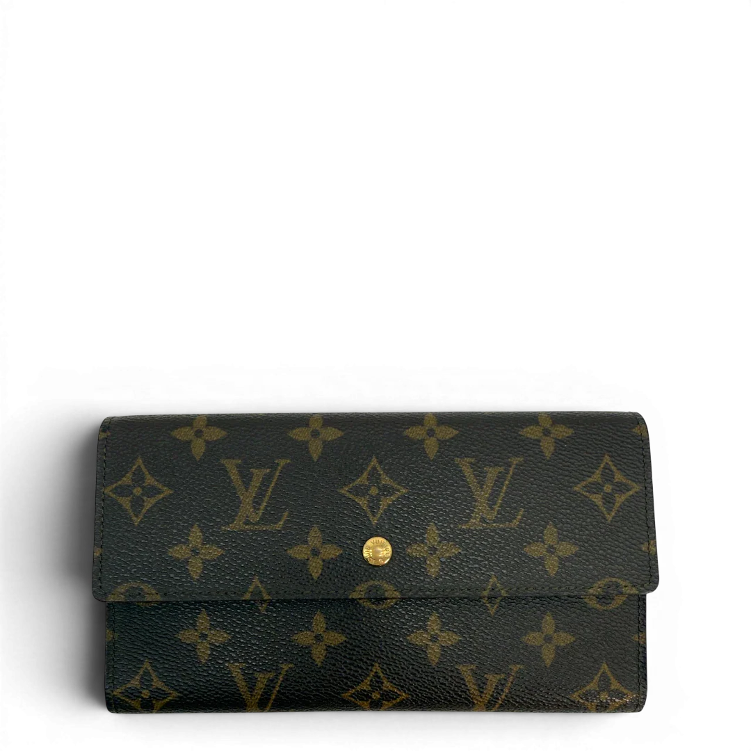 https://cdn.shopify.com/s/files/1/0564/9376/8855/files/Louis_Vuitton_Geldbeutel_Portefeuille_International_monogram_braun_vintage_LV8668.webp?v=1781083497