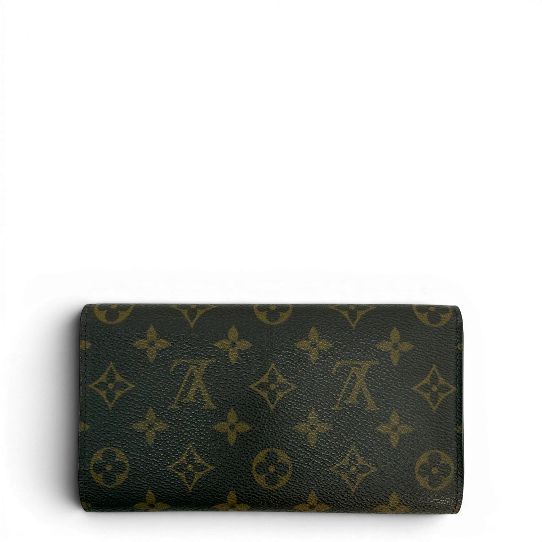 https://cdn.shopify.com/s/files/1/0564/9376/8855/files/Louis_Vuitton_Geldbeutel_Portefeuille_International_monogram_braun_vintage_LV8669.webp?v=1781083497