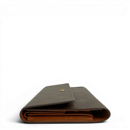 https://cdn.shopify.com/s/files/1/0564/9376/8855/files/Louis_Vuitton_Geldbeutel_Portefeuille_International_monogram_braun_vintage_LV8671.webp?v=1781083496