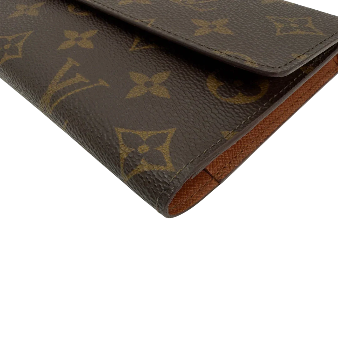 https://cdn.shopify.com/s/files/1/0564/9376/8855/files/Louis_Vuitton_Geldbeutel_Portefeuille_International_monogram_braun_vintage_LV8673.webp?v=1781083497