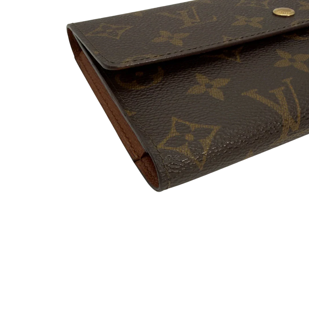 https://cdn.shopify.com/s/files/1/0564/9376/8855/files/Louis_Vuitton_Geldbeutel_Portefeuille_International_monogram_braun_vintage_LV8674.webp?v=1781083497