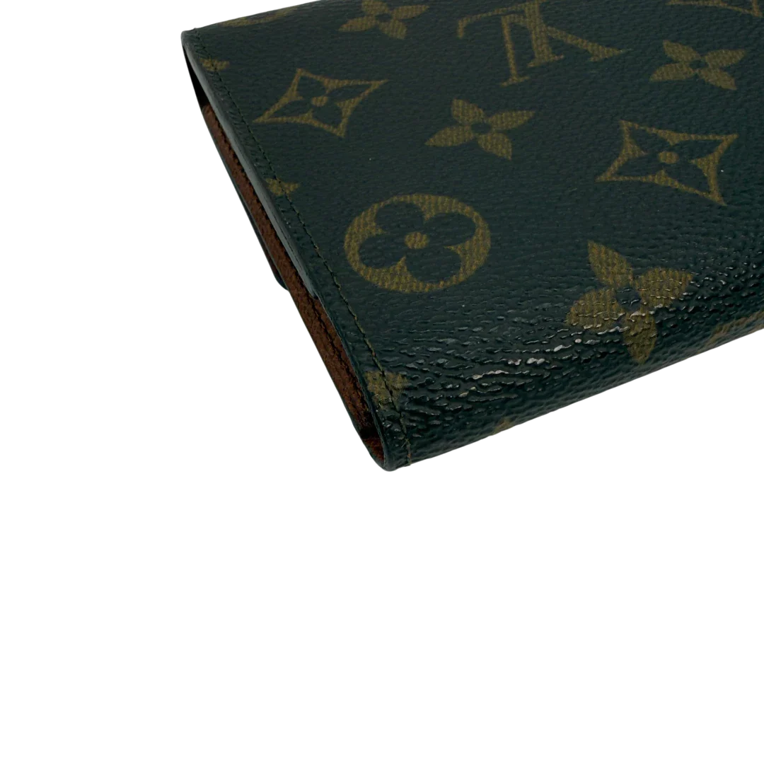 https://cdn.shopify.com/s/files/1/0564/9376/8855/files/Louis_Vuitton_Geldbeutel_Portefeuille_International_monogram_braun_vintage_LV8676.webp?v=1781083497