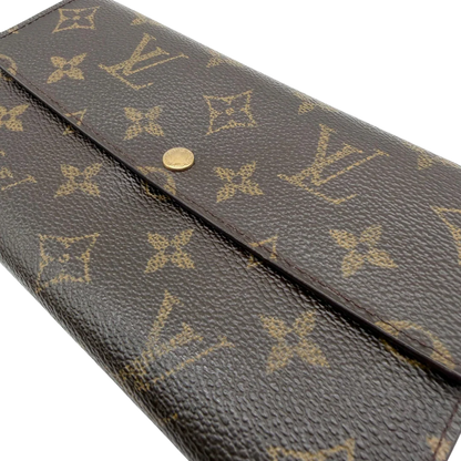 https://cdn.shopify.com/s/files/1/0564/9376/8855/files/Louis_Vuitton_Geldbeutel_Portefeuille_Sarah_monogram_braun_vintage_LV8242.webp?v=1781083758