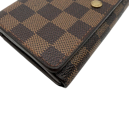 https://cdn.shopify.com/s/files/1/0564/9376/8855/files/Louis_Vuitton_Geldbeutel_Portefeuille_Tresor_Damier_Ebene_braun_vintage_LV8197.webp?v=1781083660