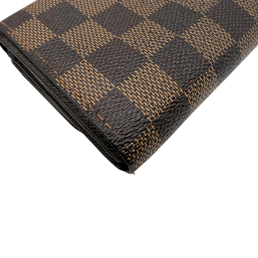https://cdn.shopify.com/s/files/1/0564/9376/8855/files/Louis_Vuitton_Geldbeutel_Portefeuille_Tresor_Damier_Ebene_braun_vintage_LV8199.webp?v=1781083660