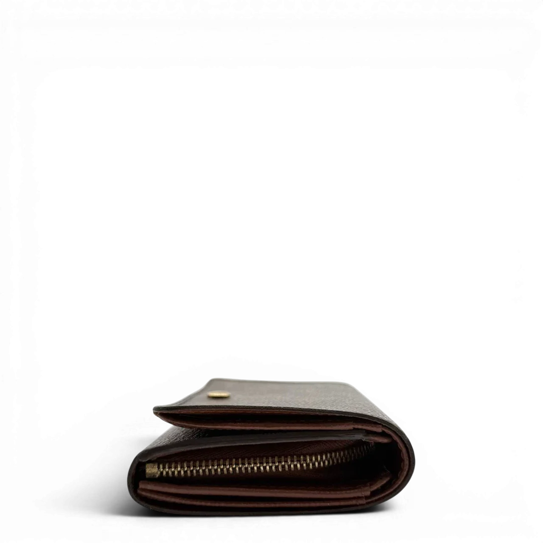 https://cdn.shopify.com/s/files/1/0564/9376/8855/files/Louis_Vuitton_Geldbeutel_Portefeuille_Tresor_monogram_braun_vintage_LV8209.webp?v=1781083289