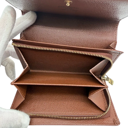 https://cdn.shopify.com/s/files/1/0564/9376/8855/files/Louis_Vuitton_Geldbeutel_Portefeuille_Tresor_monogram_braun_vintage_LV8221.webp?v=1781083290