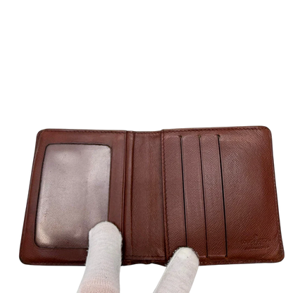 https://cdn.shopify.com/s/files/1/0564/9376/8855/files/Louis_Vuitton_Geldbeutel_Portefeuille_monogram_braun_vintage_LV7759.webp?v=1780487841