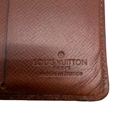 https://cdn.shopify.com/s/files/1/0564/9376/8855/files/Louis_Vuitton_Geldbeutel_Portefeuille_monogram_braun_vintage_LV7761.webp?v=1780487841
