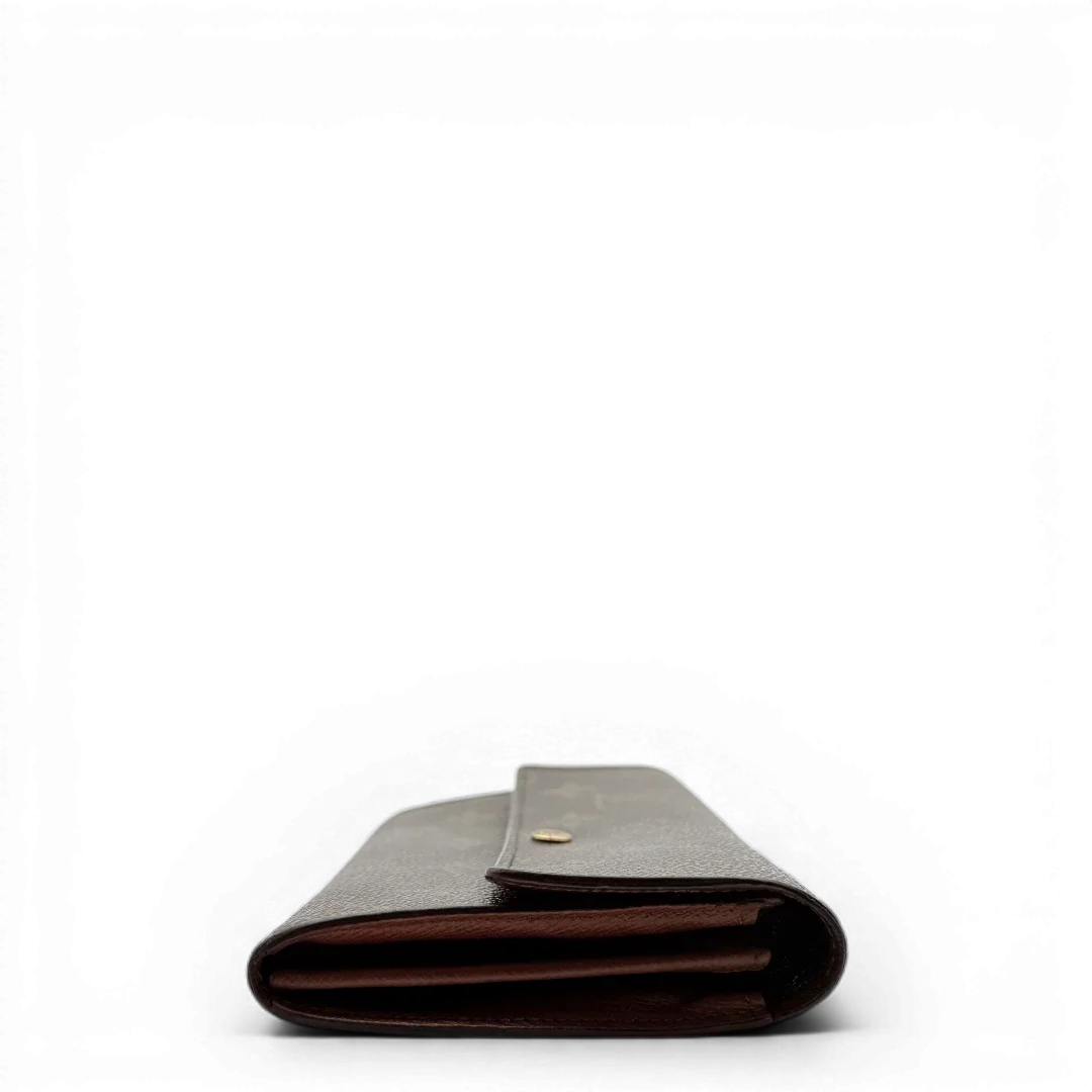https://cdn.shopify.com/s/files/1/0564/9376/8855/files/Louis_Vuitton_Geldbeutel_Sarah_monogram_braun_vintage_LV_1965.webp?v=1772115404