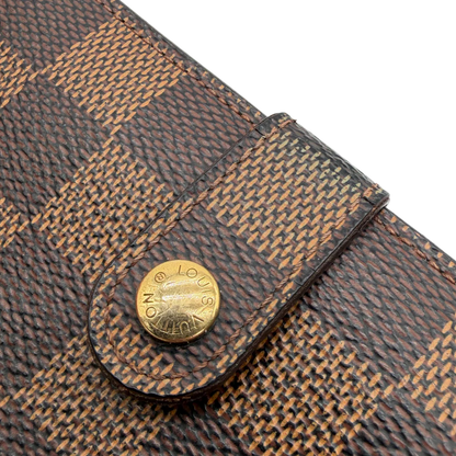 https://cdn.shopify.com/s/files/1/0564/9376/8855/files/Louis_Vuitton_Geldbeutel_Vanoise_Damier_Ebene_braun_vintage_LV_9488.webp?v=1770949460