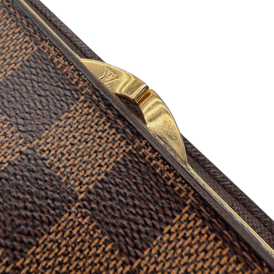https://cdn.shopify.com/s/files/1/0564/9376/8855/files/Louis_Vuitton_Geldbeutel_Vanoise_Damier_Ebene_braun_vintage_LV_9489.webp?v=1770949459