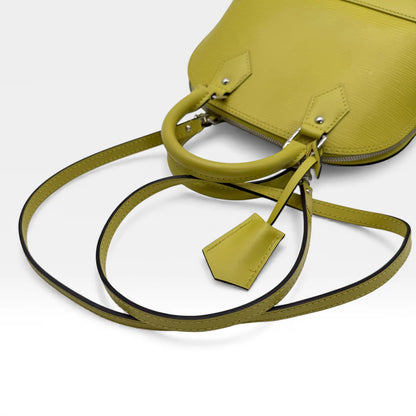 https://cdn.shopify.com/s/files/1/0564/9376/8855/files/Louis_Vuitton_Handtasche_Alma_BB_Epi_Leder_neongelb_vintage_LV_5773.webp?v=1765453895