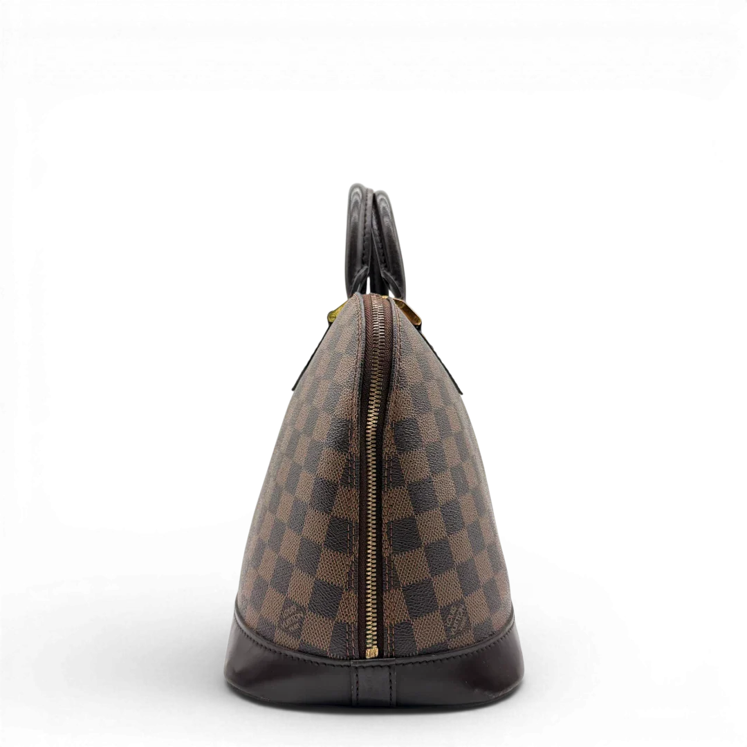 https://cdn.shopify.com/s/files/1/0564/9376/8855/files/Louis_Vuitton_Handtasche_Alma_MM_Damier_Ebene_braun_vintage_LV5937.webp?v=1778199020
