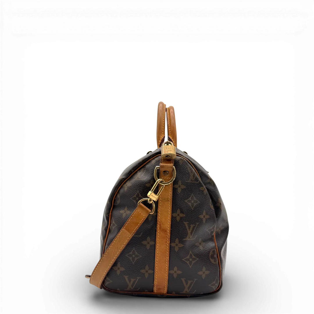 https://cdn.shopify.com/s/files/1/0564/9376/8855/files/Louis_Vuitton_Handtasche_Bandouliere_Speedy_30_monogram_braun_vintage_LV_9373.webp?v=1770948676