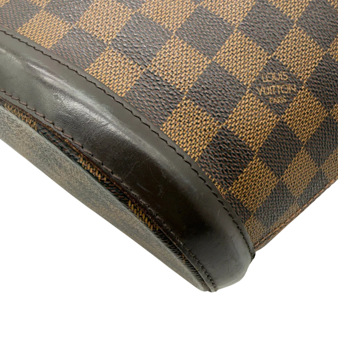 https://cdn.shopify.com/s/files/1/0564/9376/8855/files/Louis_Vuitton_Handtasche_Manosque_GM_Damier_Ebene_braun_vintage_LV8291.webp?v=1780408247