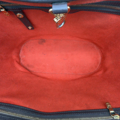 https://cdn.shopify.com/s/files/1/0564/9376/8855/files/Louis_Vuitton_Handtasche_Manosque_GM_Damier_Ebene_braun_vintage_LV8298.webp?v=1780408246
