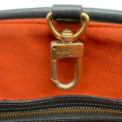 https://cdn.shopify.com/s/files/1/0564/9376/8855/files/Louis_Vuitton_Handtasche_Manosque_GM_Damier_Ebene_braun_vintage_LV8299.webp?v=1780408246
