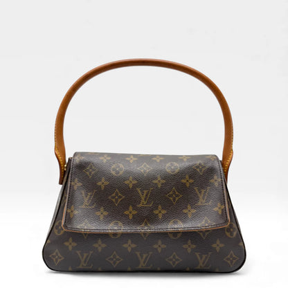 https://cdn.shopify.com/s/files/1/0564/9376/8855/files/Louis_Vuitton_Handtasche_Mini_Looping_monogram_braun_vintage_LV_handbag_5007.webp?v=1766066889