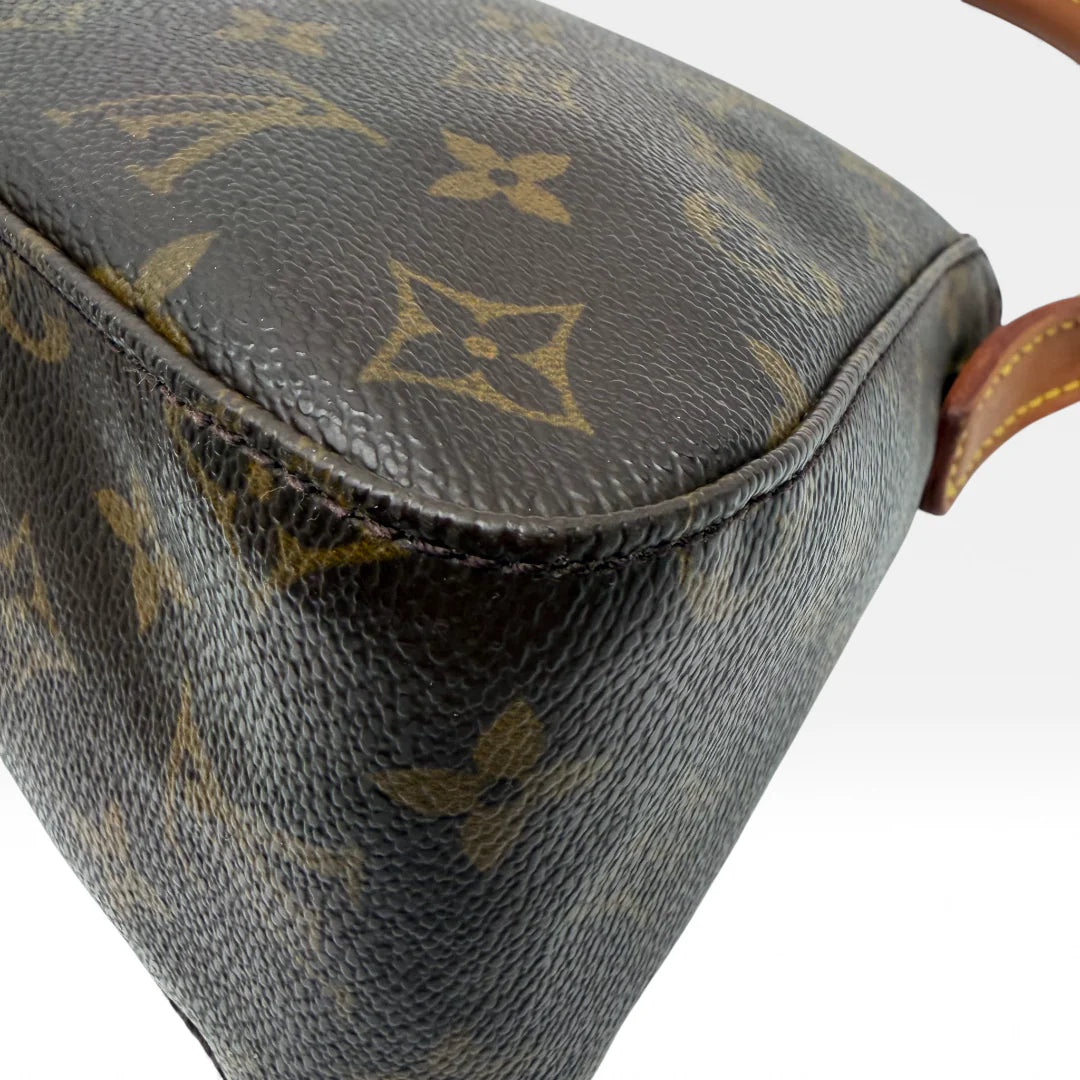 https://cdn.shopify.com/s/files/1/0564/9376/8855/files/Louis_Vuitton_Handtasche_Mini_Looping_monogram_braun_vintage_LV_handbag_5014.webp?v=1766066799