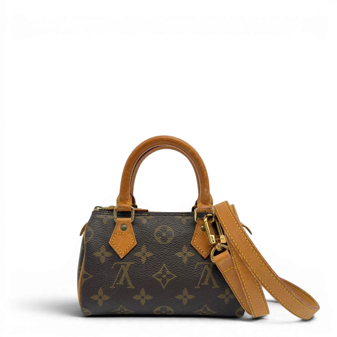 https://cdn.shopify.com/s/files/1/0564/9376/8855/files/Louis_Vuitton_Handtasche_Nano_Speedy_mit_Umhangegurt_monogram_braun_vintage_LV7667.webp?v=1779408304