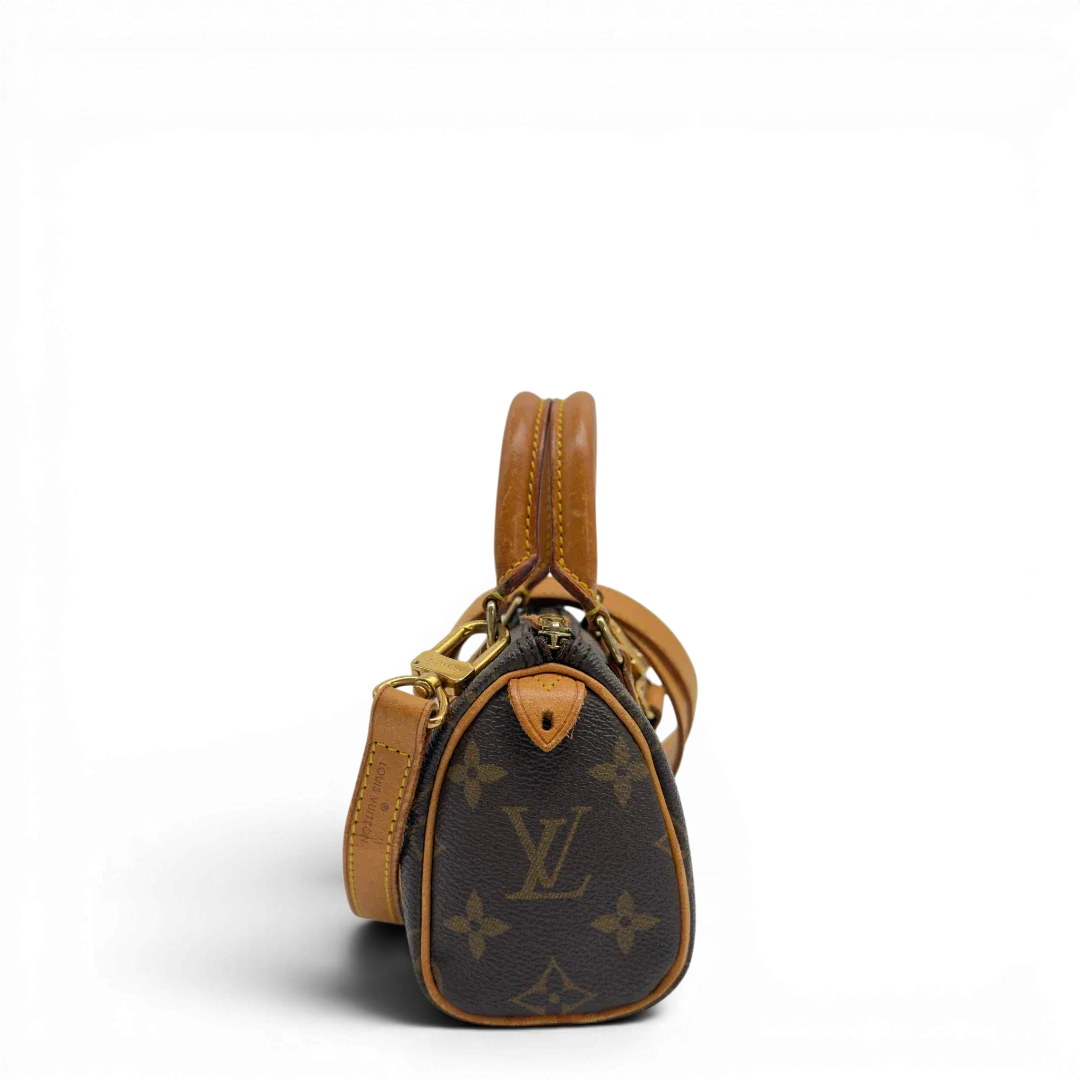 https://cdn.shopify.com/s/files/1/0564/9376/8855/files/Louis_Vuitton_Handtasche_Nano_Speedy_mit_Umhangegurt_monogram_braun_vintage_LV7670.webp?v=1779408304
