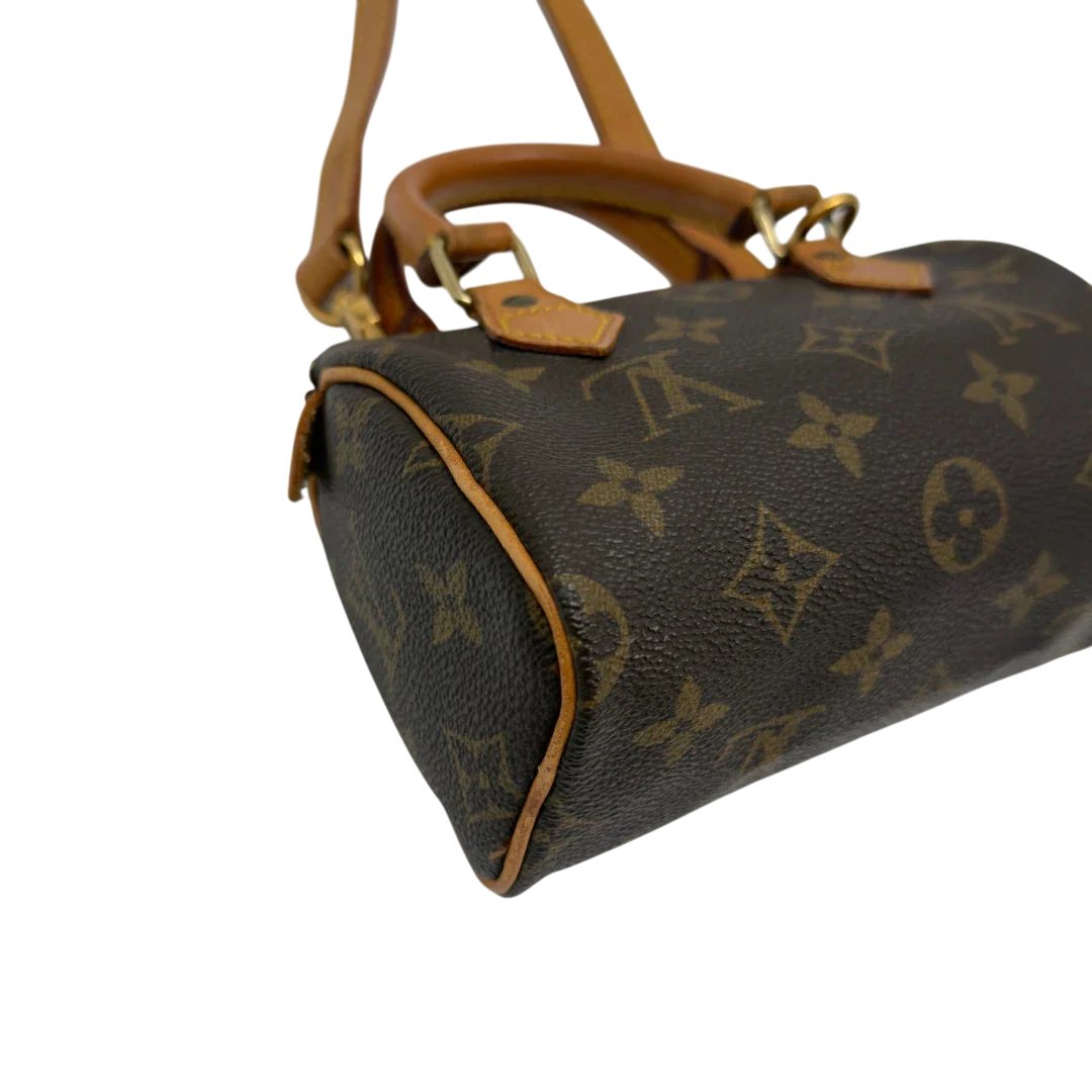 https://cdn.shopify.com/s/files/1/0564/9376/8855/files/Louis_Vuitton_Handtasche_Nano_Speedy_mit_Umhangegurt_monogram_braun_vintage_LV7674.webp?v=1779408304