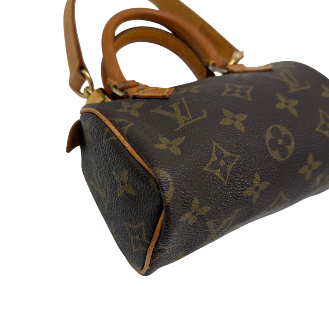 https://cdn.shopify.com/s/files/1/0564/9376/8855/files/Louis_Vuitton_Handtasche_Nano_Speedy_mit_Umhangegurt_monogram_braun_vintage_LV7676.webp?v=1779408304