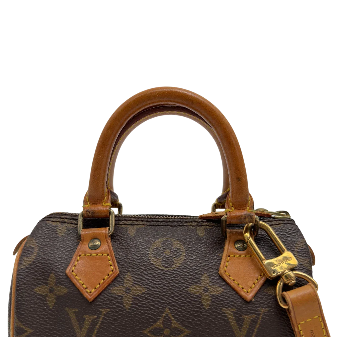 https://cdn.shopify.com/s/files/1/0564/9376/8855/files/Louis_Vuitton_Handtasche_Nano_Speedy_mit_Umhangegurt_monogram_braun_vintage_LV7679.webp?v=1779408304