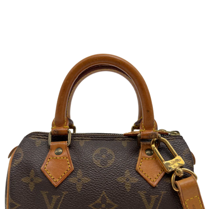 https://cdn.shopify.com/s/files/1/0564/9376/8855/files/Louis_Vuitton_Handtasche_Nano_Speedy_mit_Umhangegurt_monogram_braun_vintage_LV7679.webp?v=1779408304