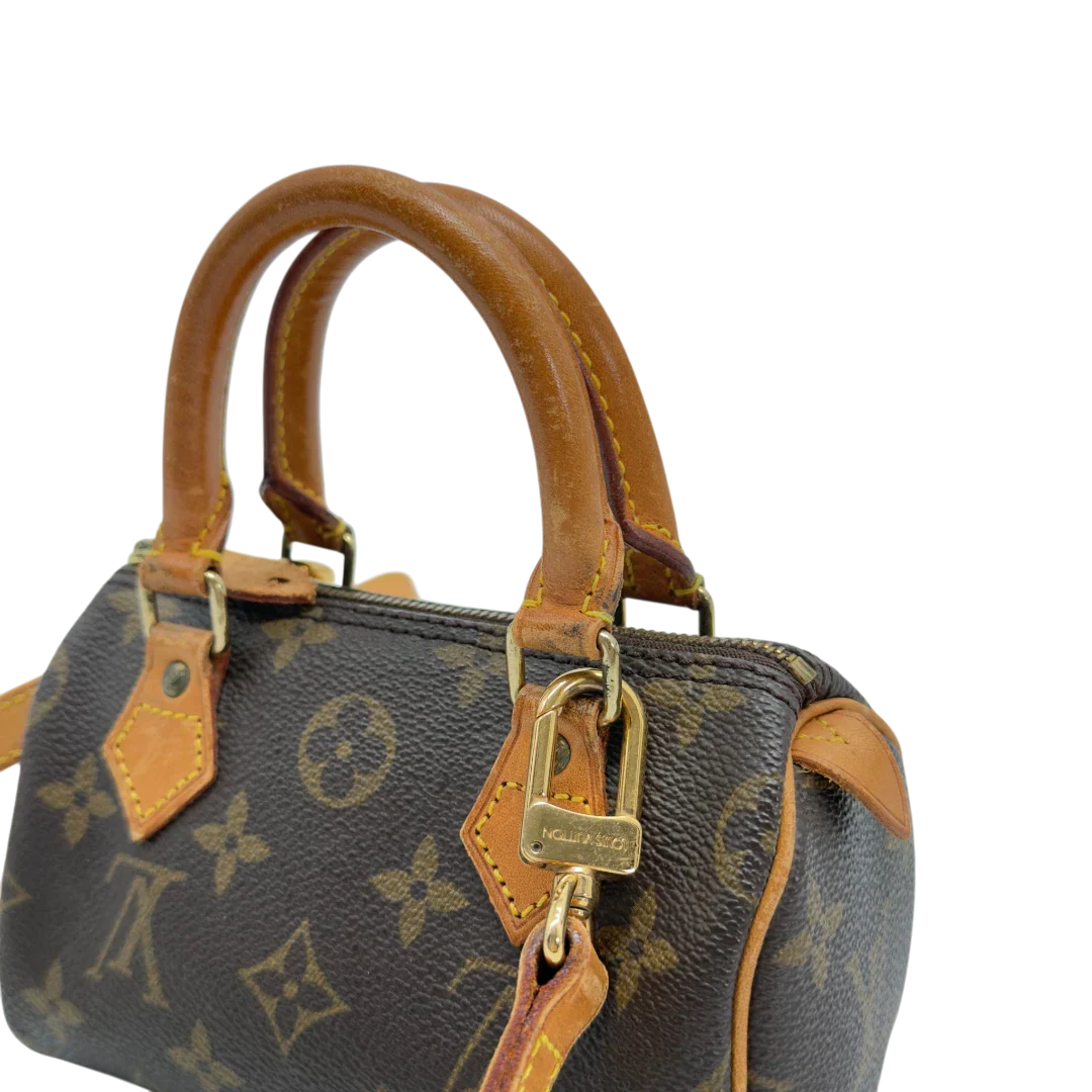 https://cdn.shopify.com/s/files/1/0564/9376/8855/files/Louis_Vuitton_Handtasche_Nano_Speedy_mit_Umhangegurt_monogram_braun_vintage_LV7682.webp?v=1779408305