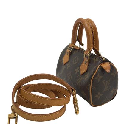 https://cdn.shopify.com/s/files/1/0564/9376/8855/files/Louis_Vuitton_Handtasche_Nano_Speedy_mit_Umhangegurt_monogram_braun_vintage_LV7685.webp?v=1779408304