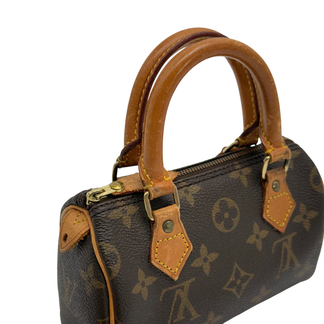 https://cdn.shopify.com/s/files/1/0564/9376/8855/files/Louis_Vuitton_Handtasche_Nano_Speedy_mit_Umhangegurt_monogram_braun_vintage_LV7686.webp?v=1779408304