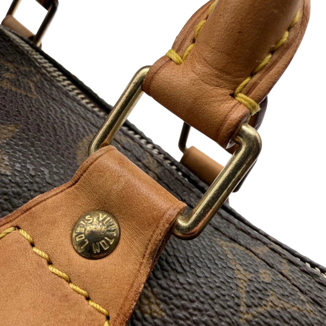 https://cdn.shopify.com/s/files/1/0564/9376/8855/files/Louis_Vuitton_Handtasche_Speedy_25_monogram_braun_vintage_LV5909.webp?v=1778067576