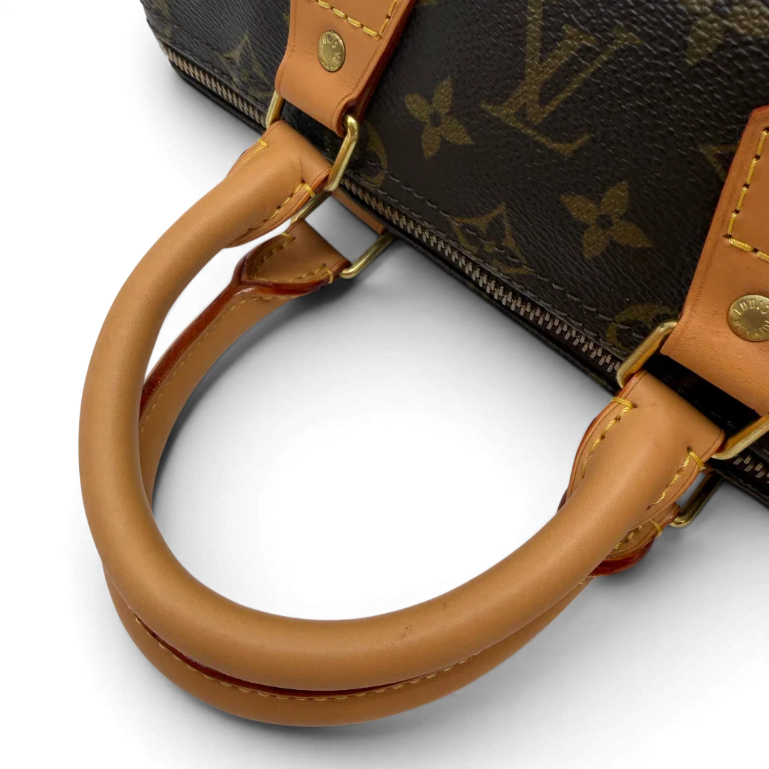 https://cdn.shopify.com/s/files/1/0564/9376/8855/files/Louis_Vuitton_Handtasche_Speedy_25_monogram_braun_vintage_LV7701.webp?v=1780487970