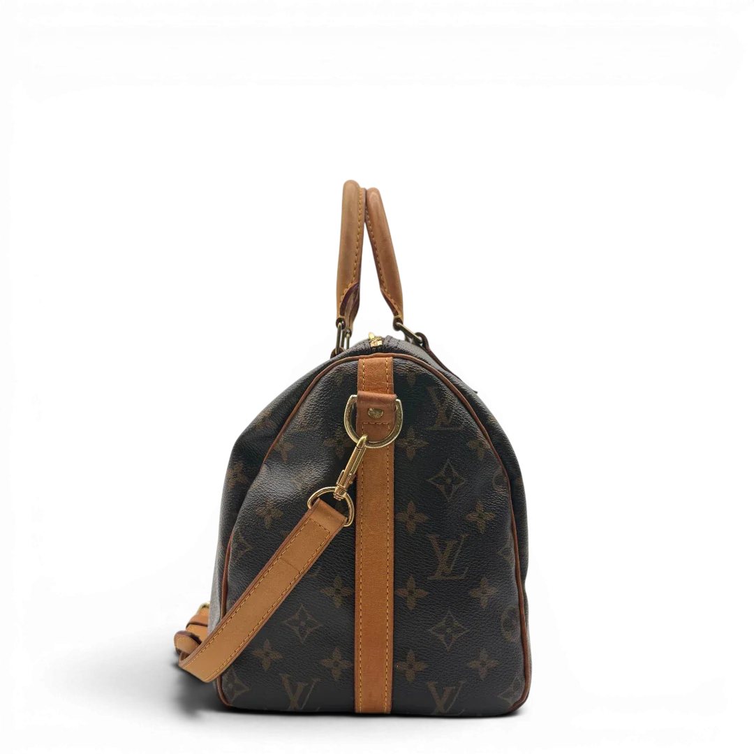https://cdn.shopify.com/s/files/1/0564/9376/8855/files/Louis_Vuitton_Handtasche_Speedy_30_Bandouliere_monogram_braun_vintage_LV7464.webp?v=1779894866