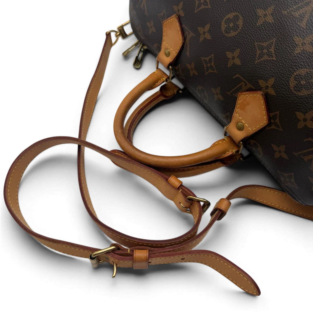 https://cdn.shopify.com/s/files/1/0564/9376/8855/files/Louis_Vuitton_Handtasche_Speedy_30_Bandouliere_monogram_braun_vintage_LV7471.webp?v=1779894869