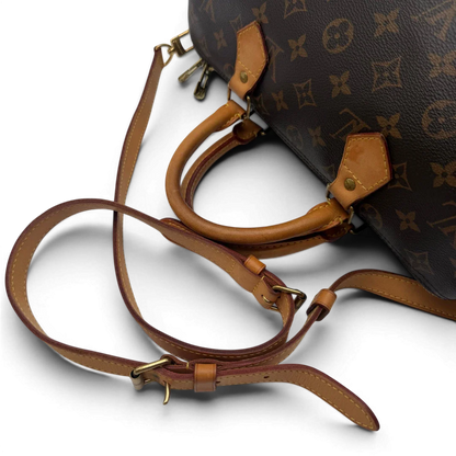 https://cdn.shopify.com/s/files/1/0564/9376/8855/files/Louis_Vuitton_Handtasche_Speedy_30_Bandouliere_monogram_braun_vintage_LV7471.webp?v=1779894869