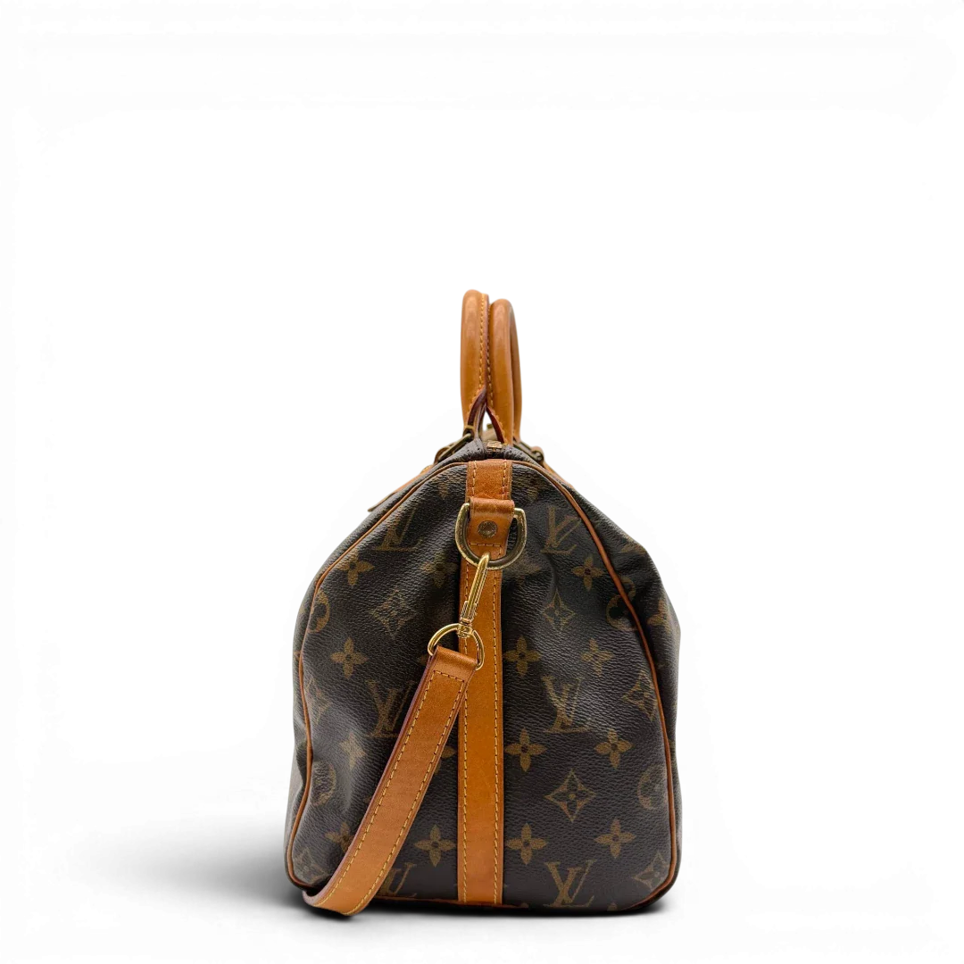 https://cdn.shopify.com/s/files/1/0564/9376/8855/files/Louis_Vuitton_Handtasche_Speedy_30_Bandouliere_monogram_braun_vintage_LV8325.webp?v=1781052726