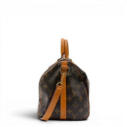 https://cdn.shopify.com/s/files/1/0564/9376/8855/files/Louis_Vuitton_Handtasche_Speedy_30_Bandouliere_monogram_braun_vintage_LV8325.webp?v=1781052726