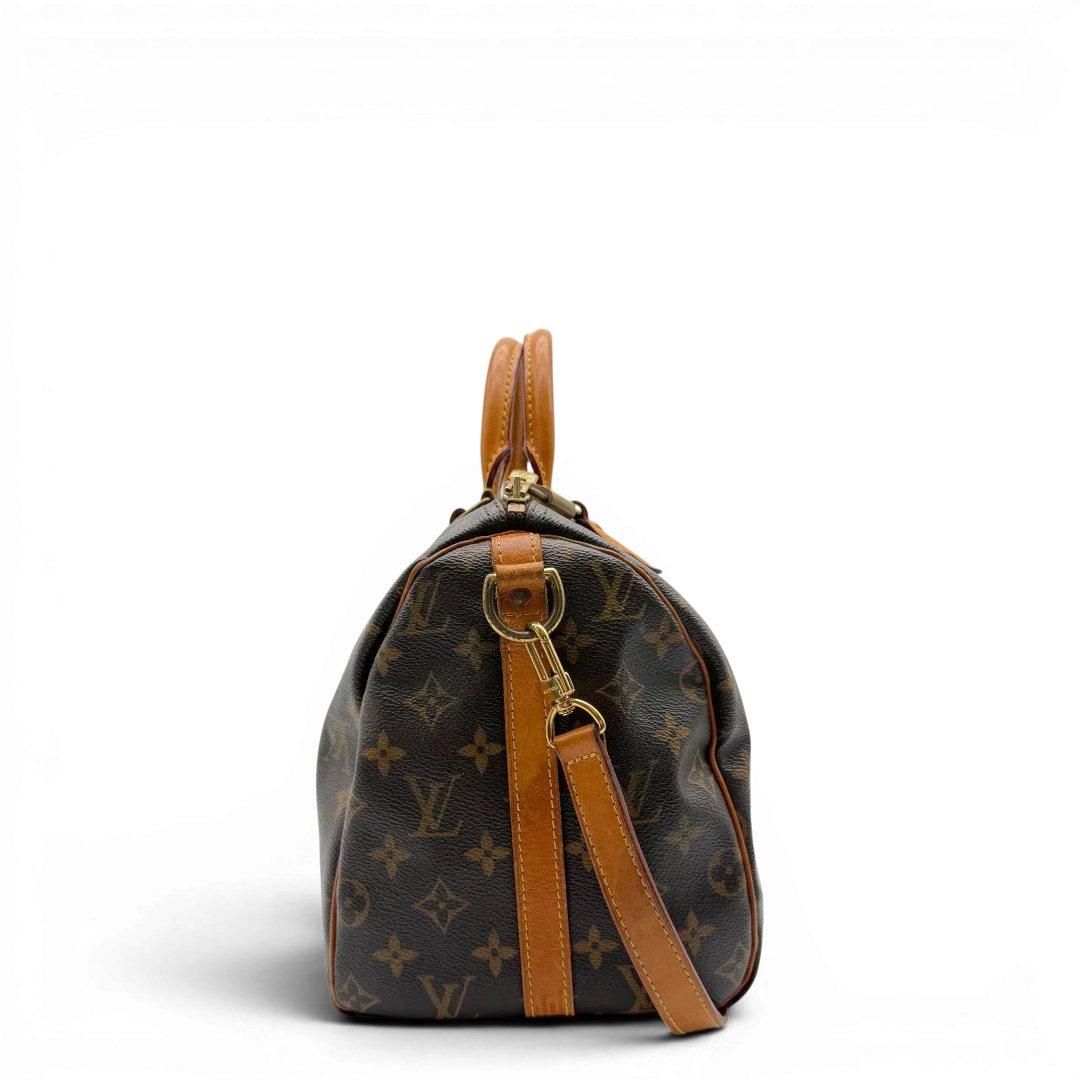 https://cdn.shopify.com/s/files/1/0564/9376/8855/files/Louis_Vuitton_Handtasche_Speedy_30_Bandouliere_monogram_braun_vintage_LV8326.webp?v=1781052727