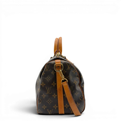 https://cdn.shopify.com/s/files/1/0564/9376/8855/files/Louis_Vuitton_Handtasche_Speedy_30_Bandouliere_monogram_braun_vintage_LV8326.webp?v=1781052727