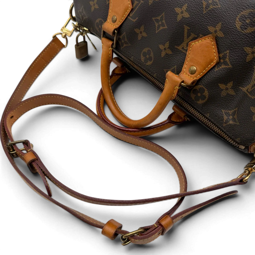 https://cdn.shopify.com/s/files/1/0564/9376/8855/files/Louis_Vuitton_Handtasche_Speedy_30_Bandouliere_monogram_braun_vintage_LV8332.webp?v=1781052727